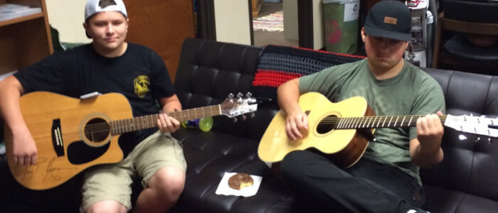 Crosstimbers Academy Students Playing Guitar